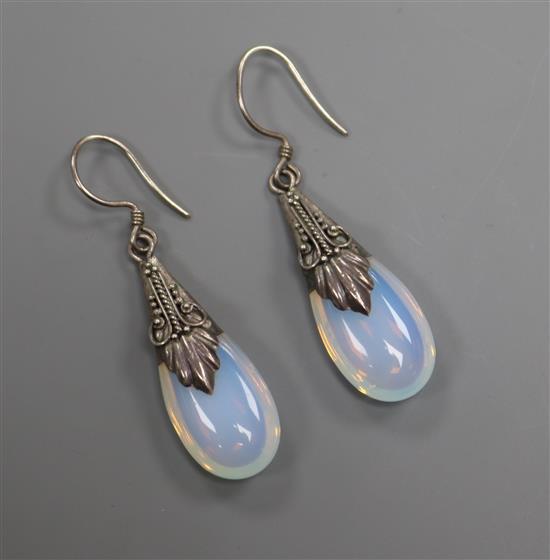 A pair of white metal mounted pear shaped moonstone drop earrings, 32mm.